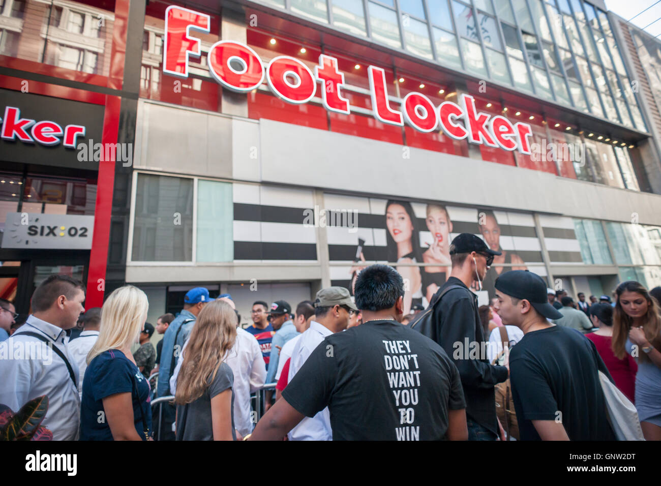 Hordes of shoppers outside the new experiential Foot Locker store in Herald Square in New York on opening day, Tuesday, August 30, 2016. The 10,000 square foot store is organized by brand as opposed to product category with separate areas for their Six:02, House of Hoops, and other brands. The store is on the second floor with a new Sephora to open at street level (hence the poster of the three models).  (© Richard B. Levine) Stock Photo