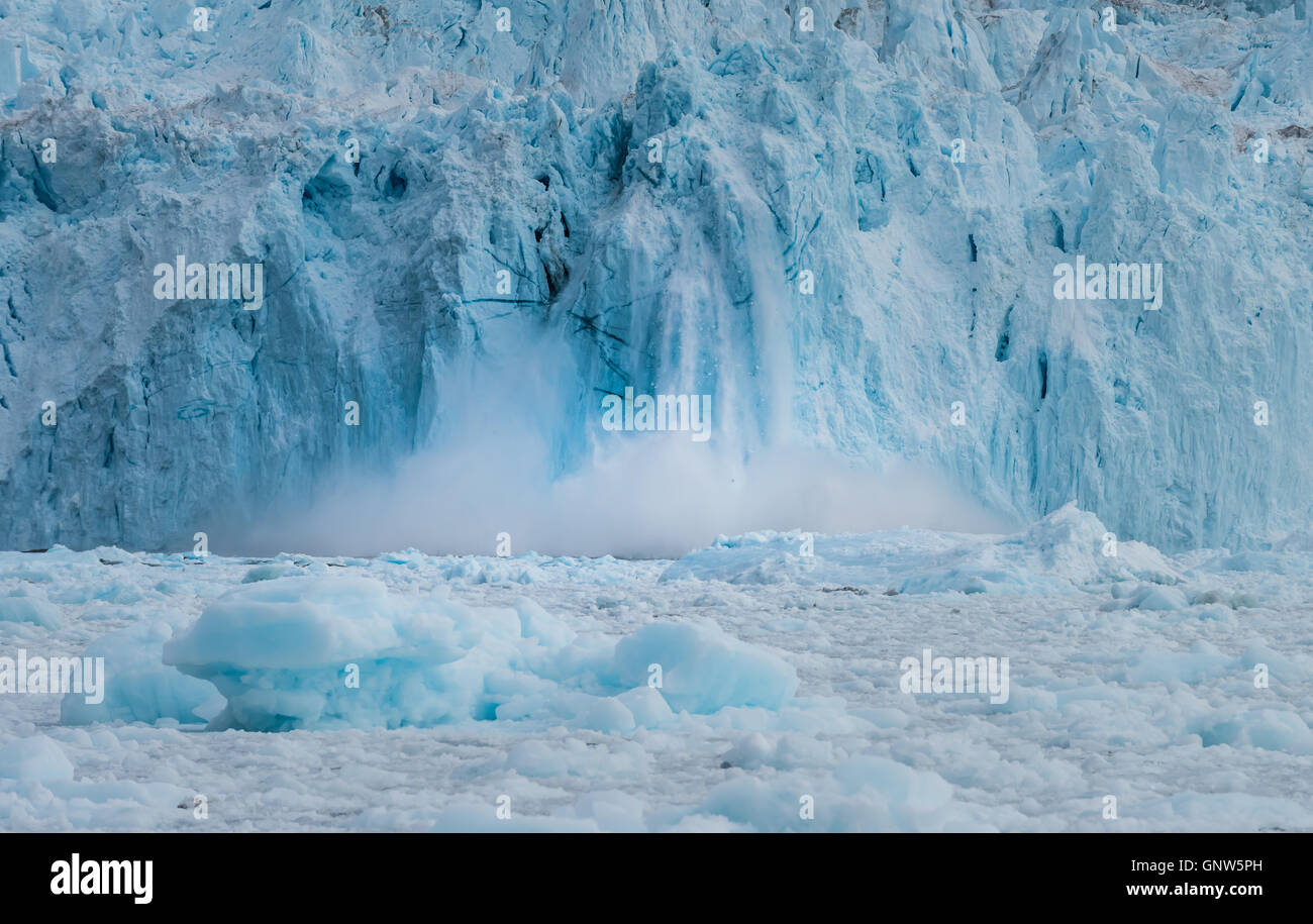 Rapidly calving Eqi glacier, huge icebergs are constantly formed ...