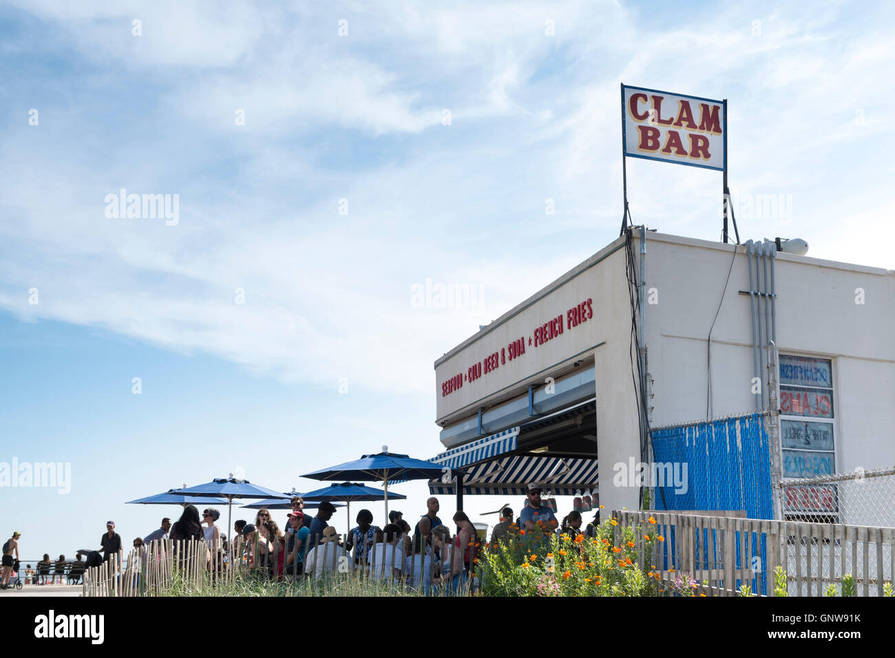 People sitting outside of Paul's Daughter bar and restaurant and clam