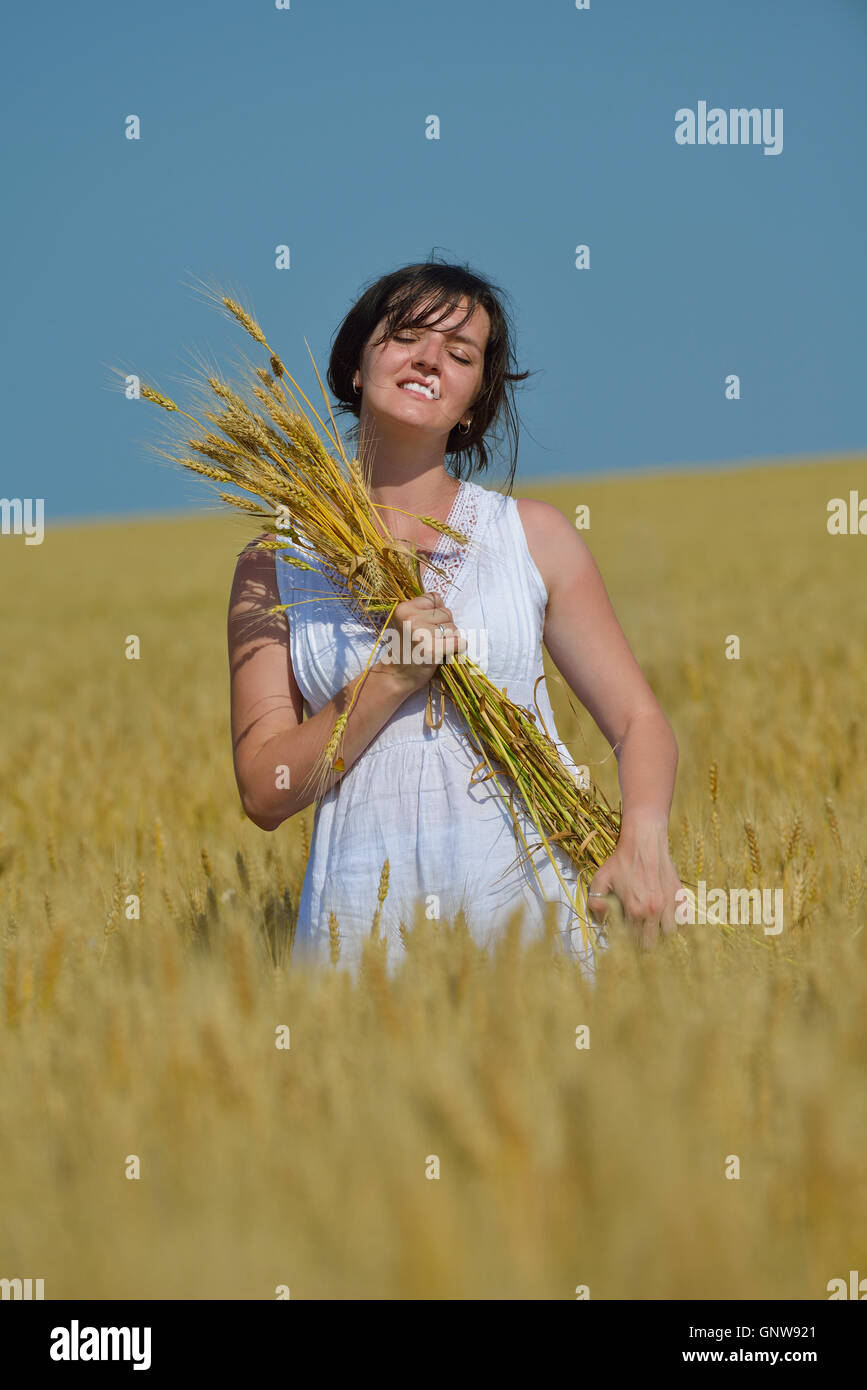 young woman in wheat field at summer Stock Photo - Alamy
