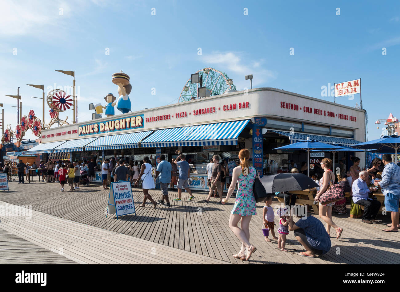 People sitting outside of Paul's Daughter bar and restaurant and clam