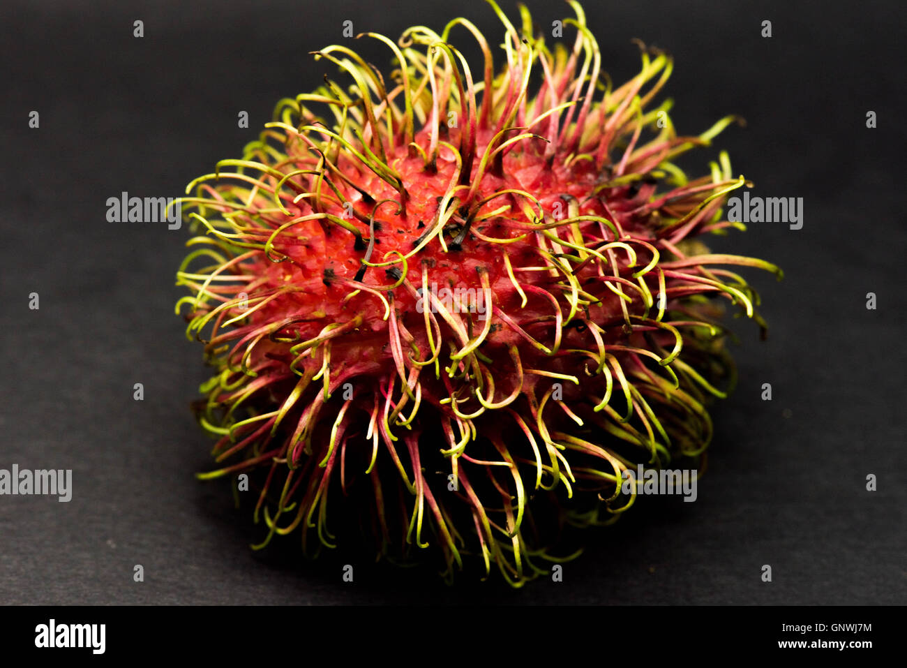 Red hairy fruit hi-res stock photography and images - Alamy