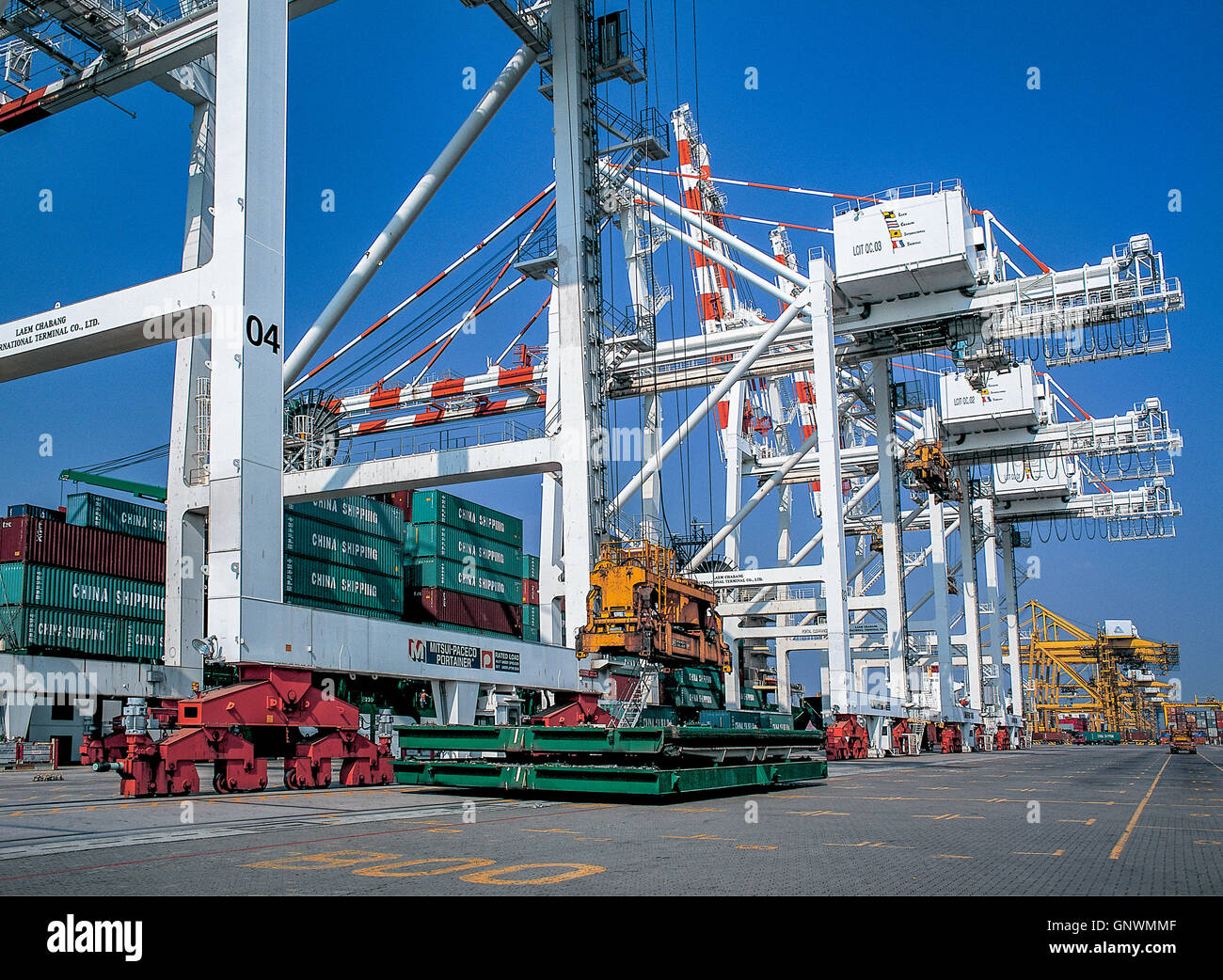 Moving Containers in Ports Shipyard and loading into the ship Stock