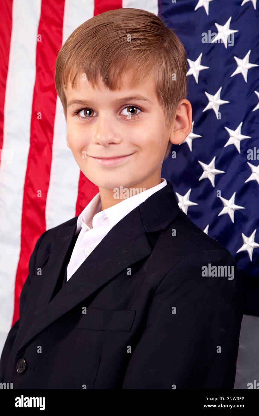 Portait of Caucasian boy with American flag Stock Photo