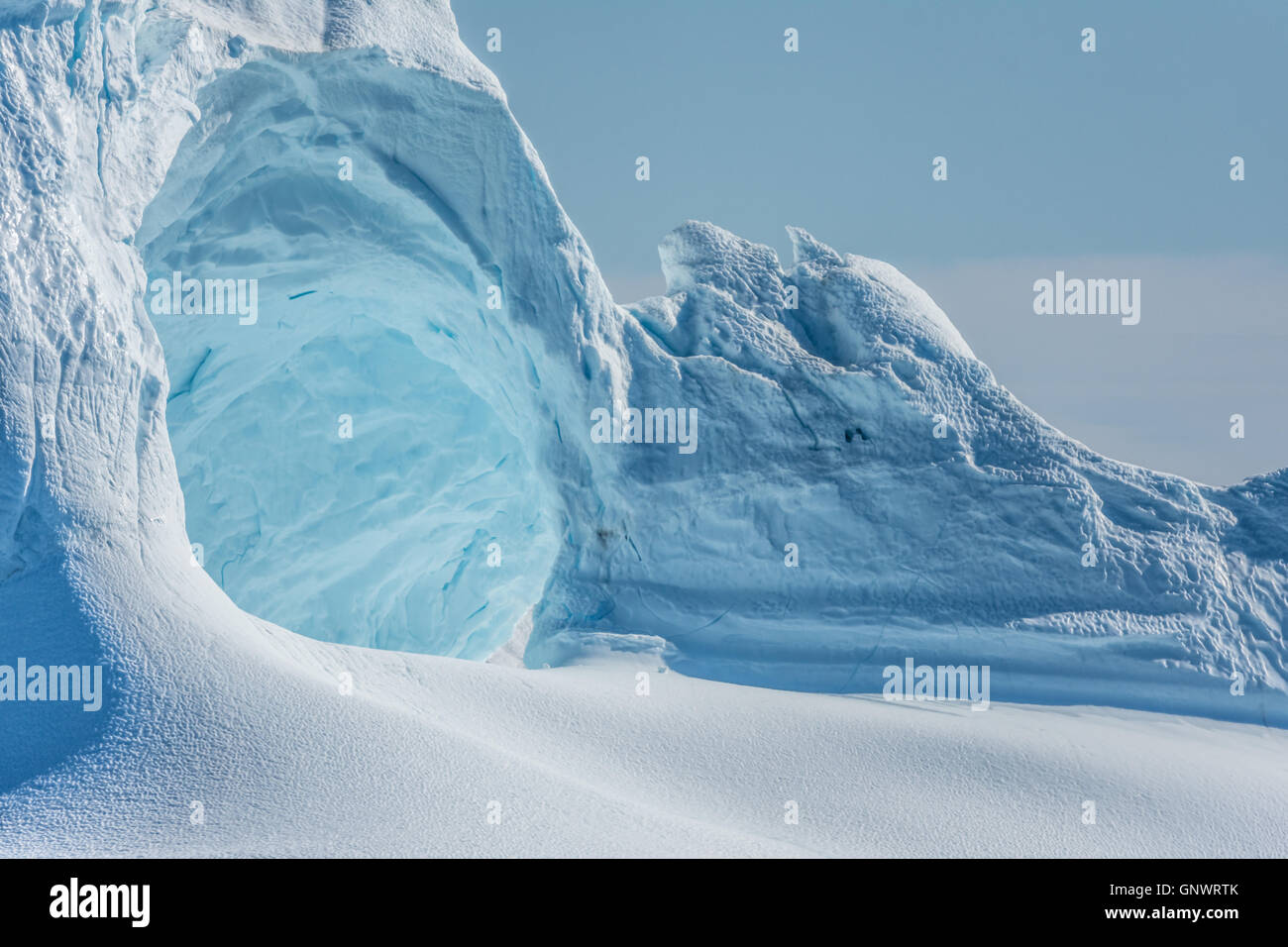 Huge stranded icebergs at the mouth of the Icejord near Ilulissat at midnight, Greenland Stock Photo