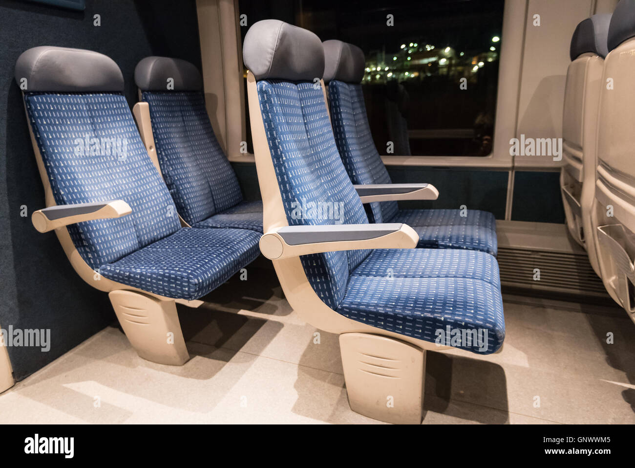 Six blue train seats  of a French train at night Stock Photo