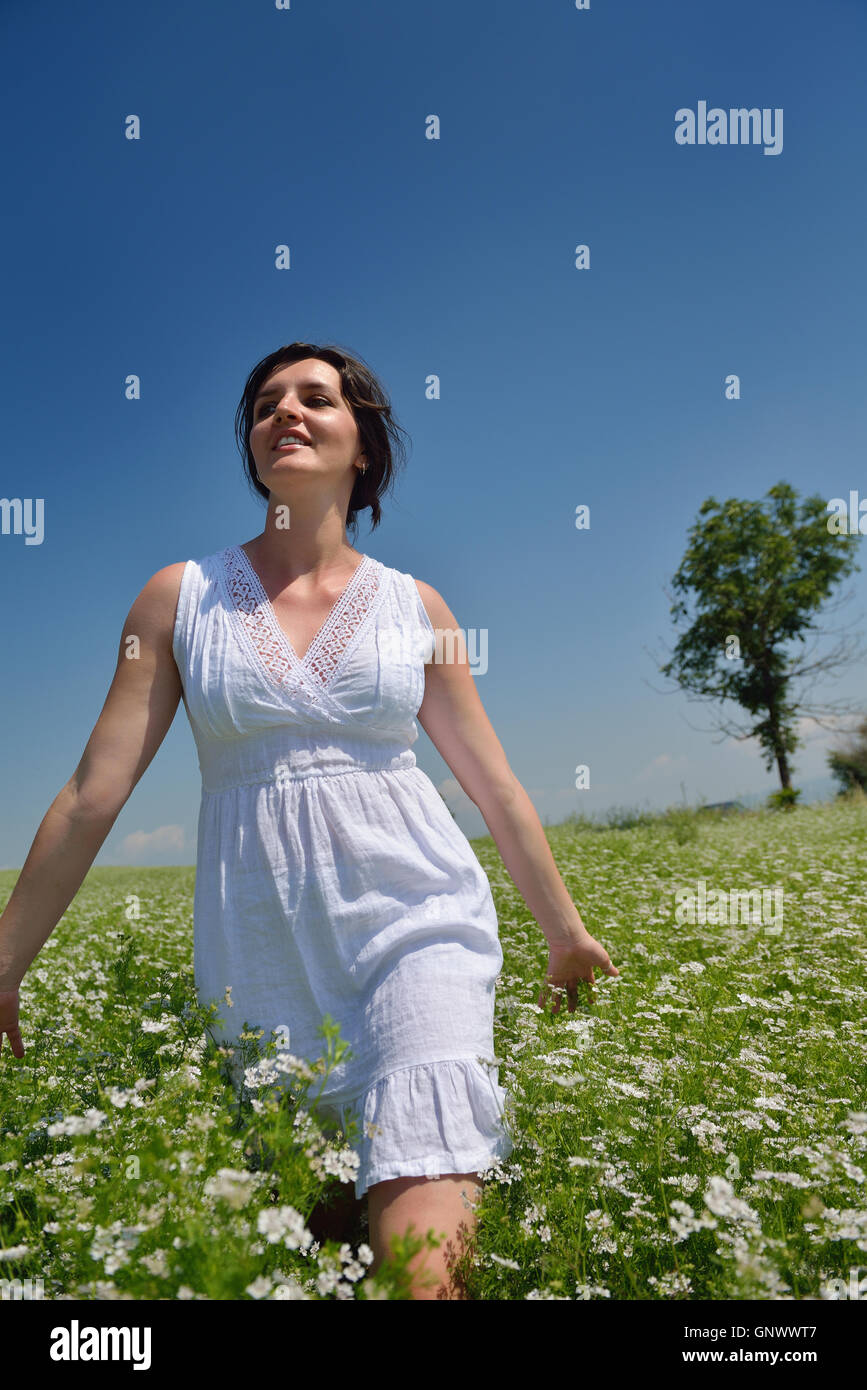 Young happy woman in green field Stock Photo - Alamy
