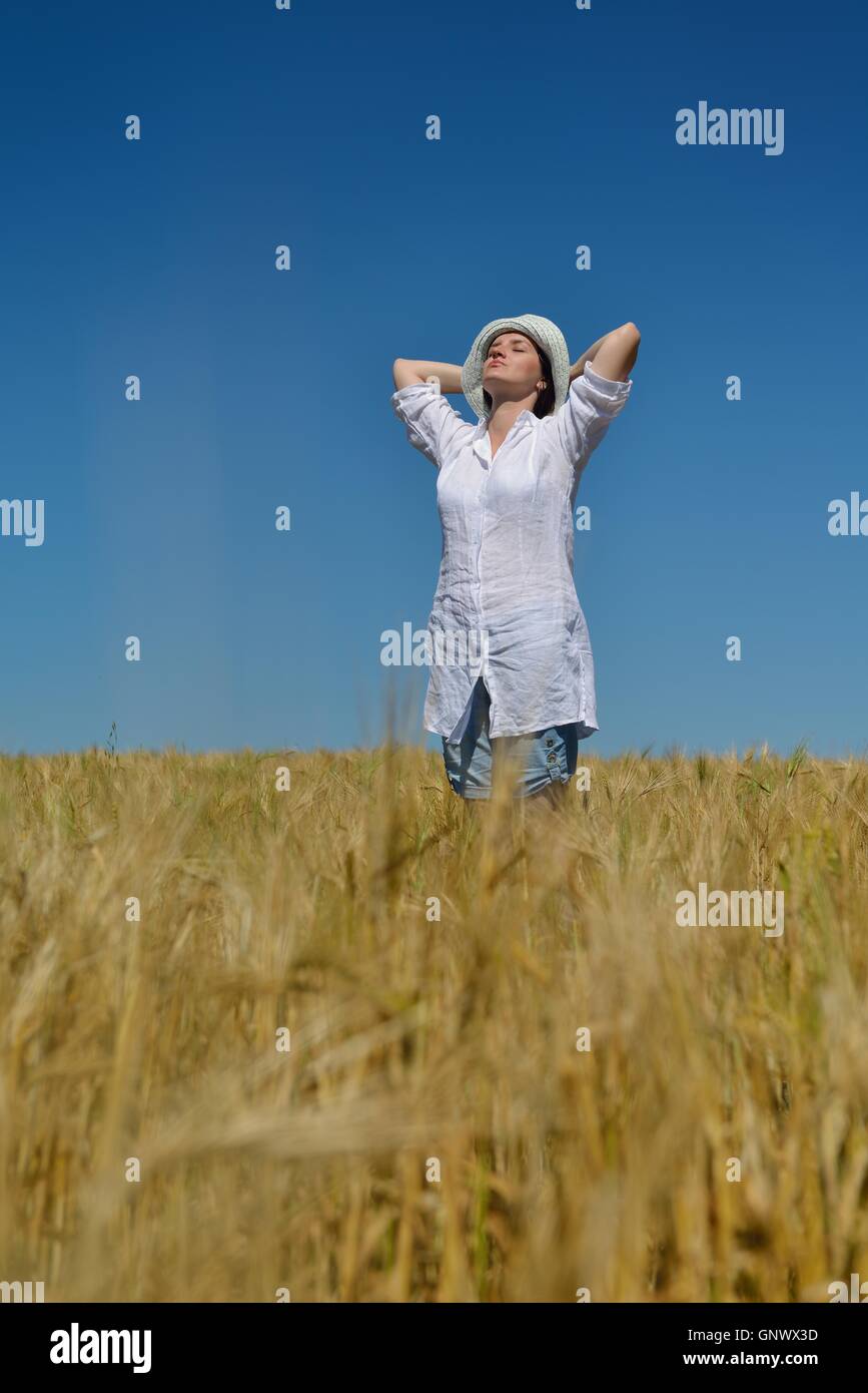young woman in wheat field at summer Stock Photo - Alamy