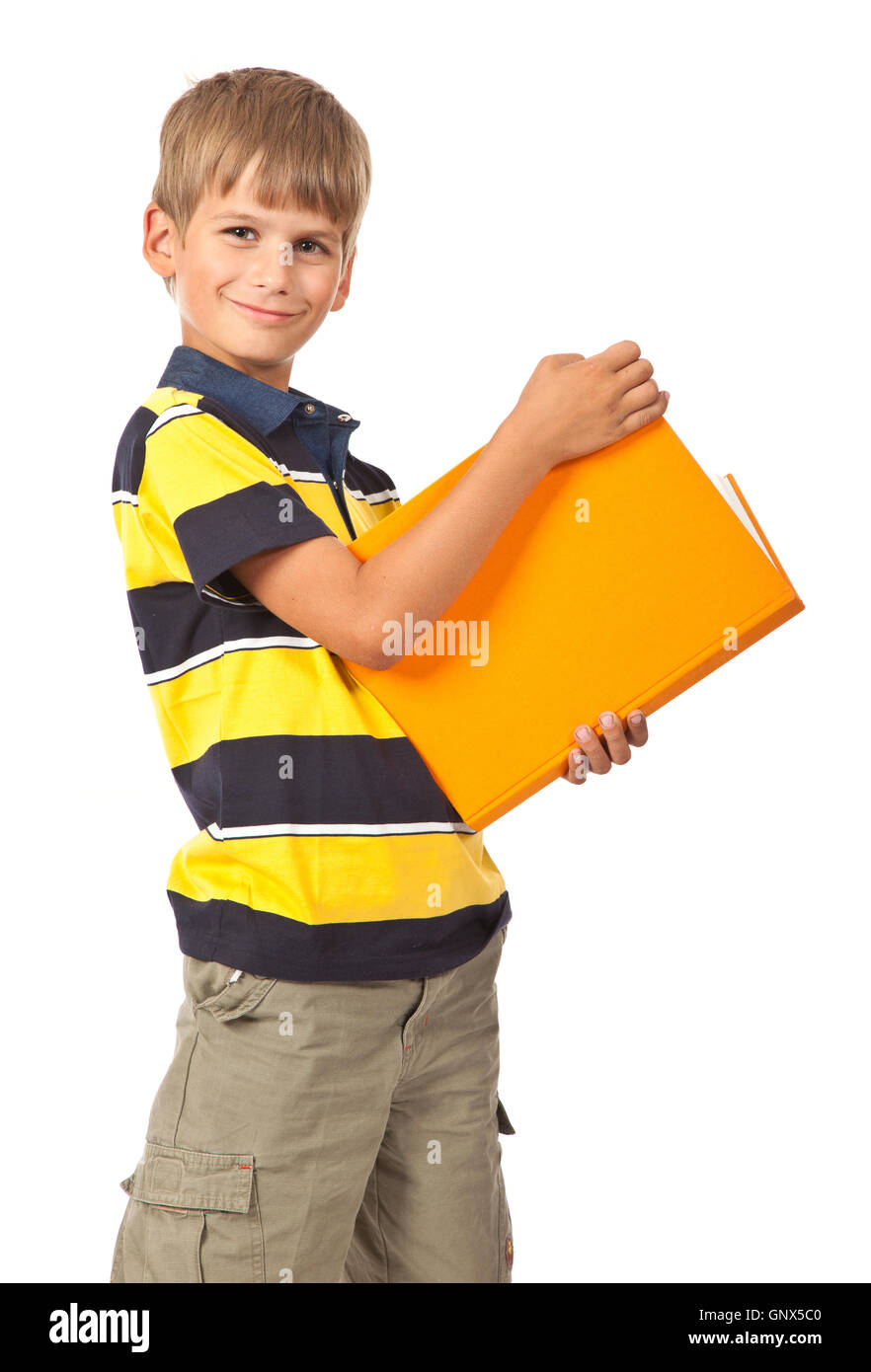 School boy is holding a book Stock Photo - Alamy