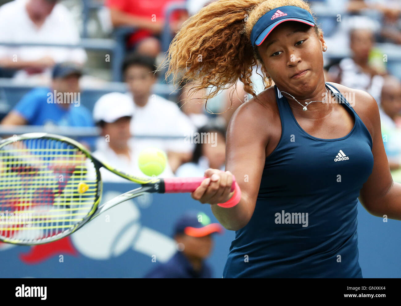 New York, USA. 31st Aug, 2016. Naomi Osaka of Japan hits a return to Duan Yingying of China during a women's singles second round match at the 2016 U.S. Open tennis tournament in New York, the United States, Aug. 31, 2016. Naomi Osaka won 2-0. Credit:  Qin Lang/Xinhua/Alamy Live News Stock Photo