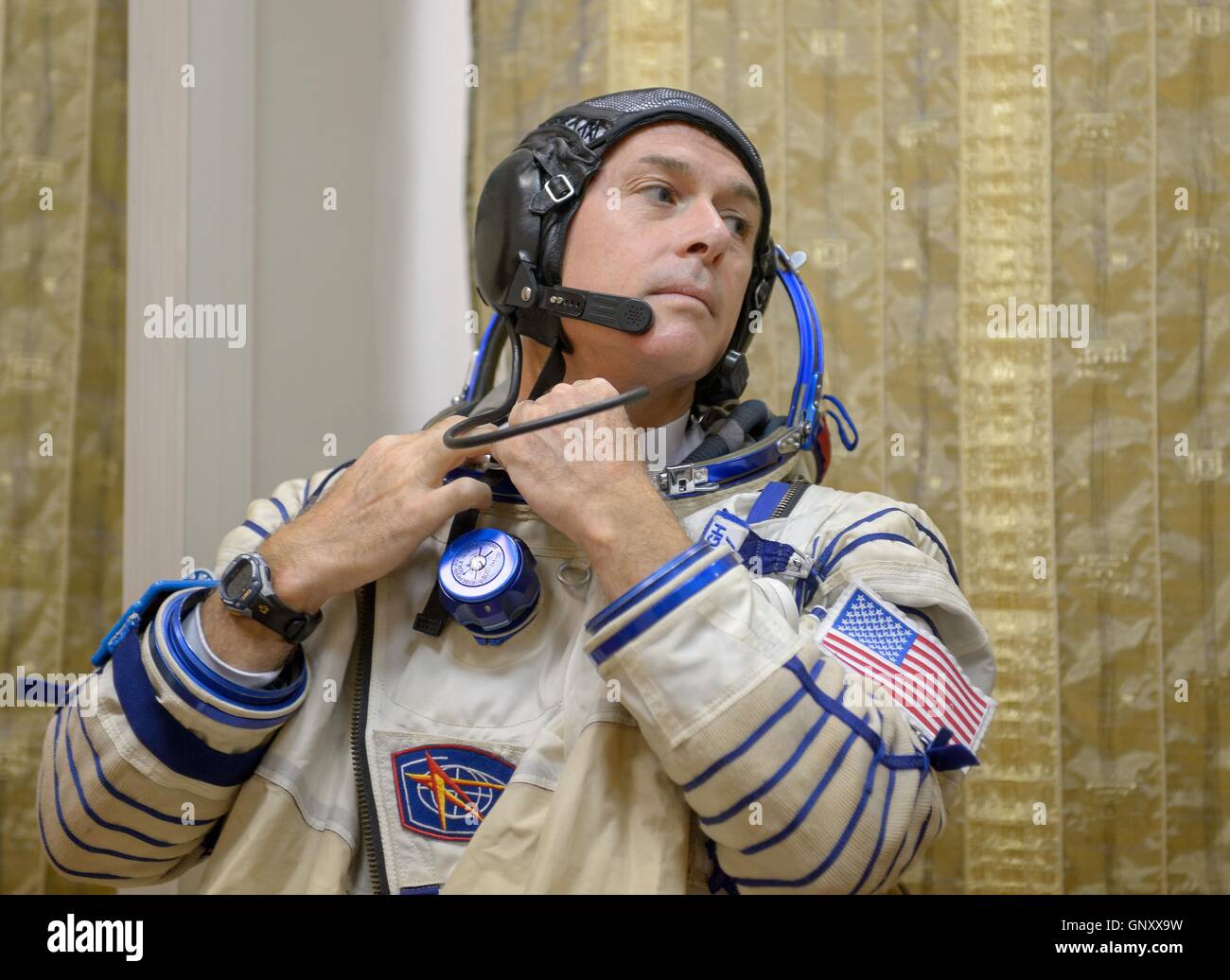 International Space Station Expedition 49-50 prime crew American astronaut Shane Kimbrough dresses in his Sokol spacesuit in preparation for the Soyuz qualification exams at the Gagarin Cosmonaut Training Center August 31, 2016 at Star City, Russia. Stock Photo