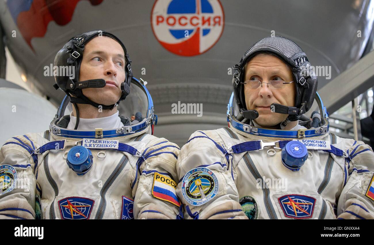 International Space Station Expedition 49-50 prime crew Russian cosmonauts Sergei Ryzhikov, left, and Andrey Borisenko take questions from the media before entering the Soyuz simulator ahead of their Soyuz qualification exams at the Gagarin Cosmonaut Training Center August 31, 2016 at Star City, Russia. Stock Photo