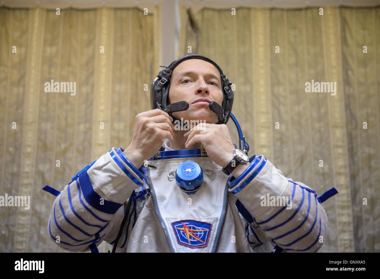 International Space Station Expedition 49-50 prime crew Russian cosmonaut Sergei Ryzhikov dresses in his Sokol spacesuit in preparation for the Soyuz qualification exams at the Gagarin Cosmonaut Training Center August 31, 2016 at Star City, Russia. Stock Photo