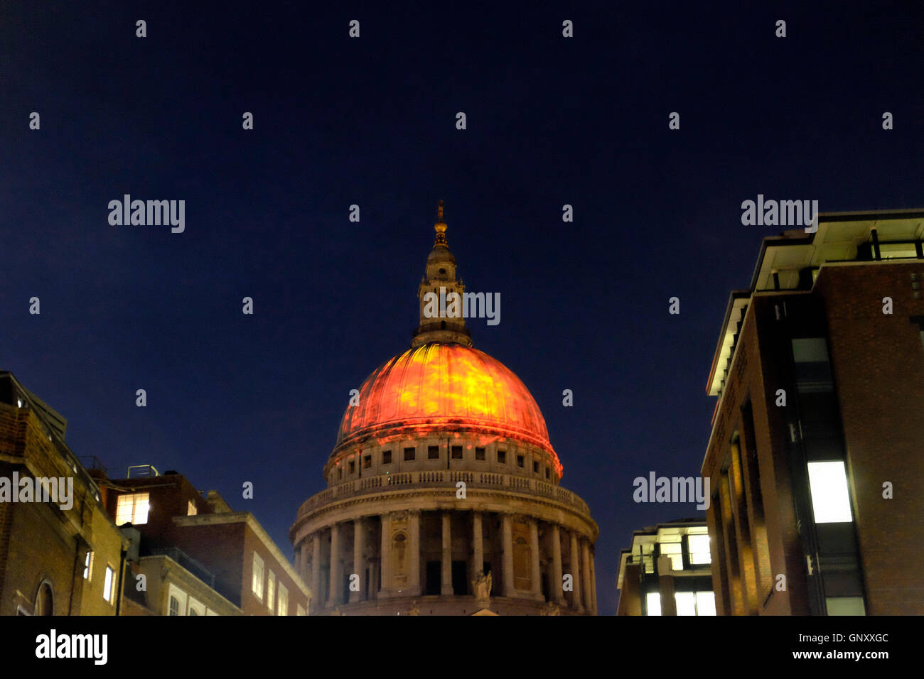 A  view of the dome of St Paul's Cathedral, lit up with a fiery projection as part of London's burning festival Stock Photo