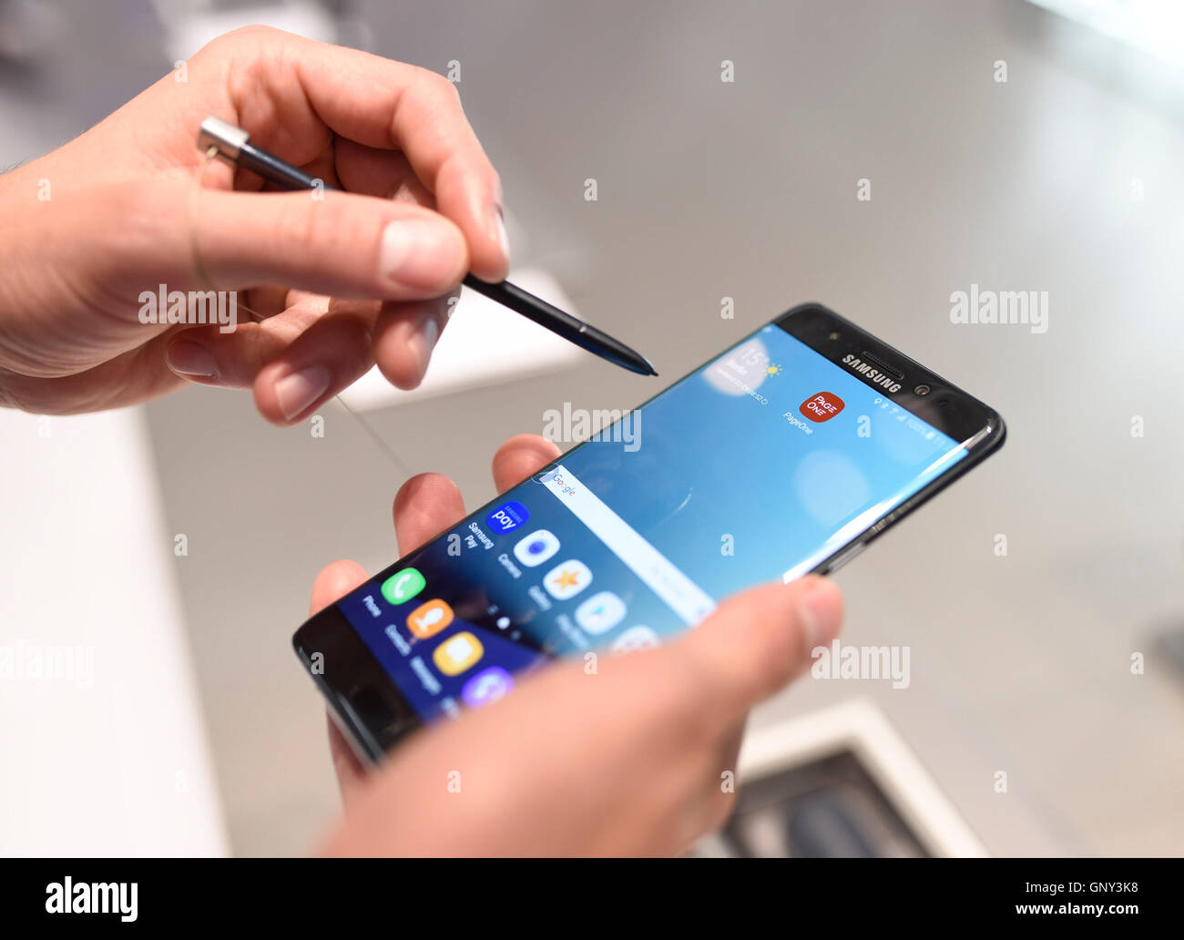 Berlin, Germany. 2nd Sep, 2016. A Samsung Galaxy Note 7 being held at the Internationale Funk-Ausstellung IFA 2016 in Berlin, Germany, 2 September 2016. Due to overheating batteries and danger of fire, SDamsung calls back the new model. PHOTO: JANNIS MATTAR/dpa/Alamy Live News Stock Photo