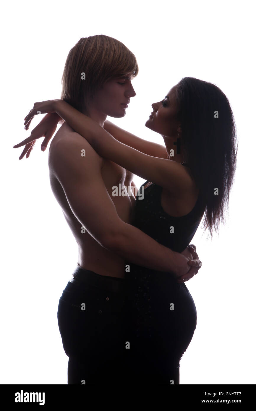 Portrait of happy young couple hugging Stock Photo - Alamy
