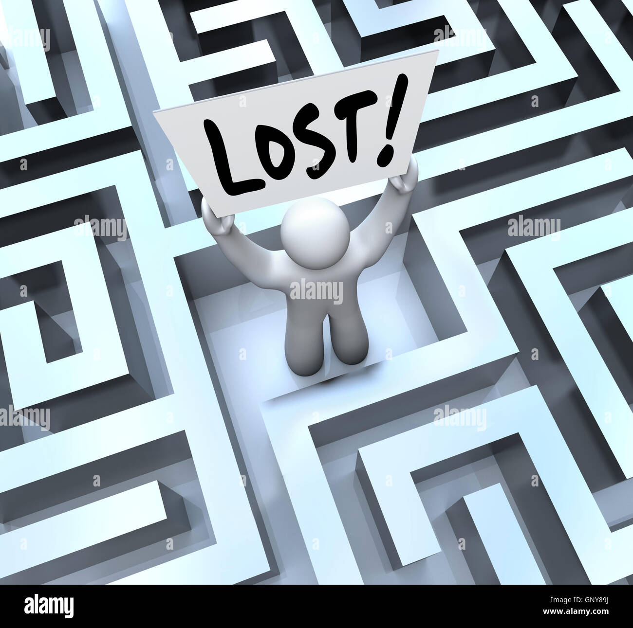 Lost Man Holding Sign in Labyrinth Maze Stock Photo