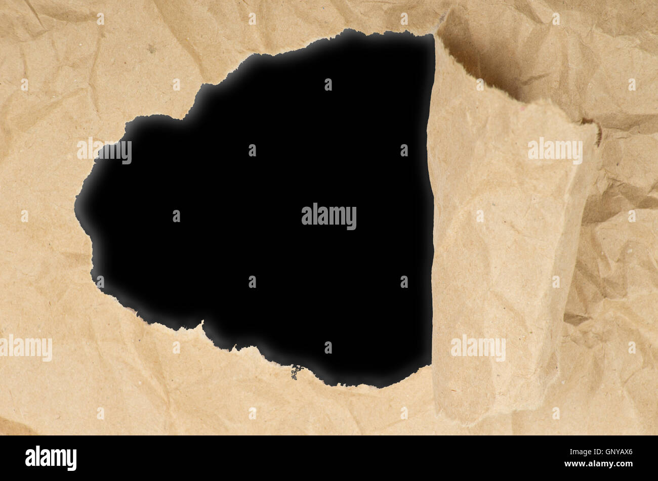 ripped white paper against a black background Stock Photo - Alamy