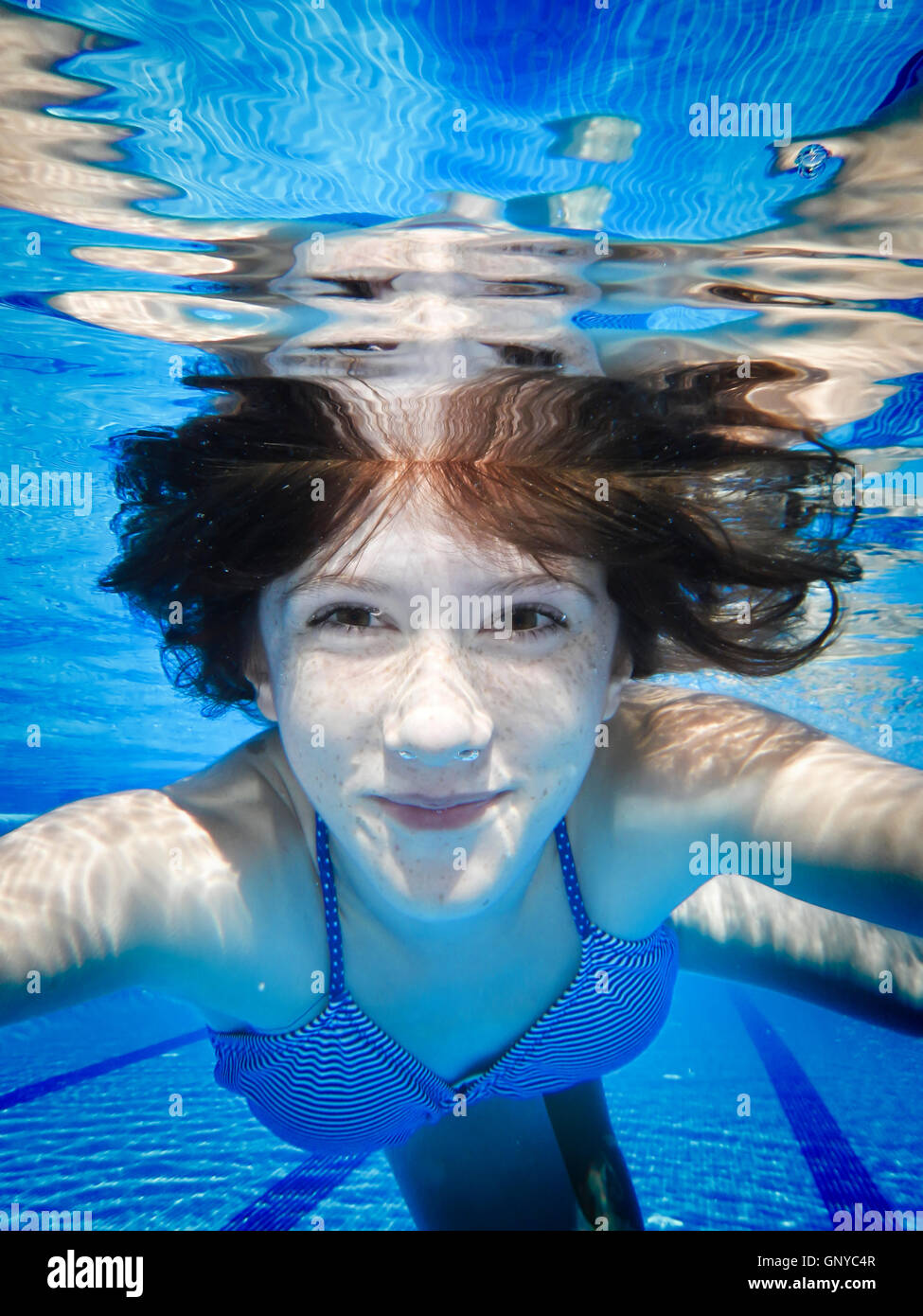 Teenage swimming underwater in the pool Stock Photo - Alamy