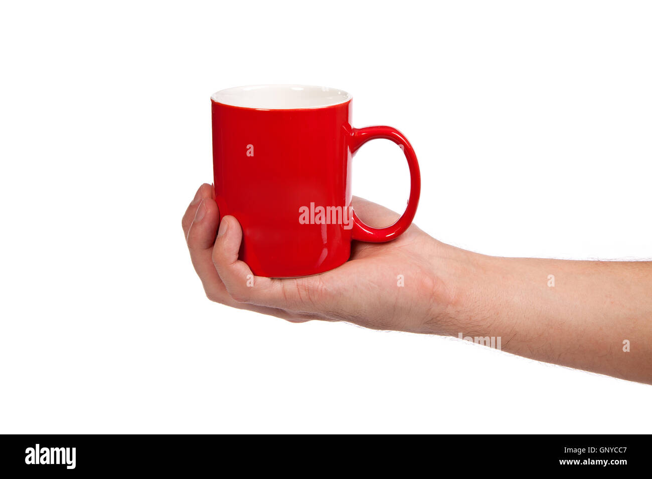 Male hand is holding a red cup Stock Photo
