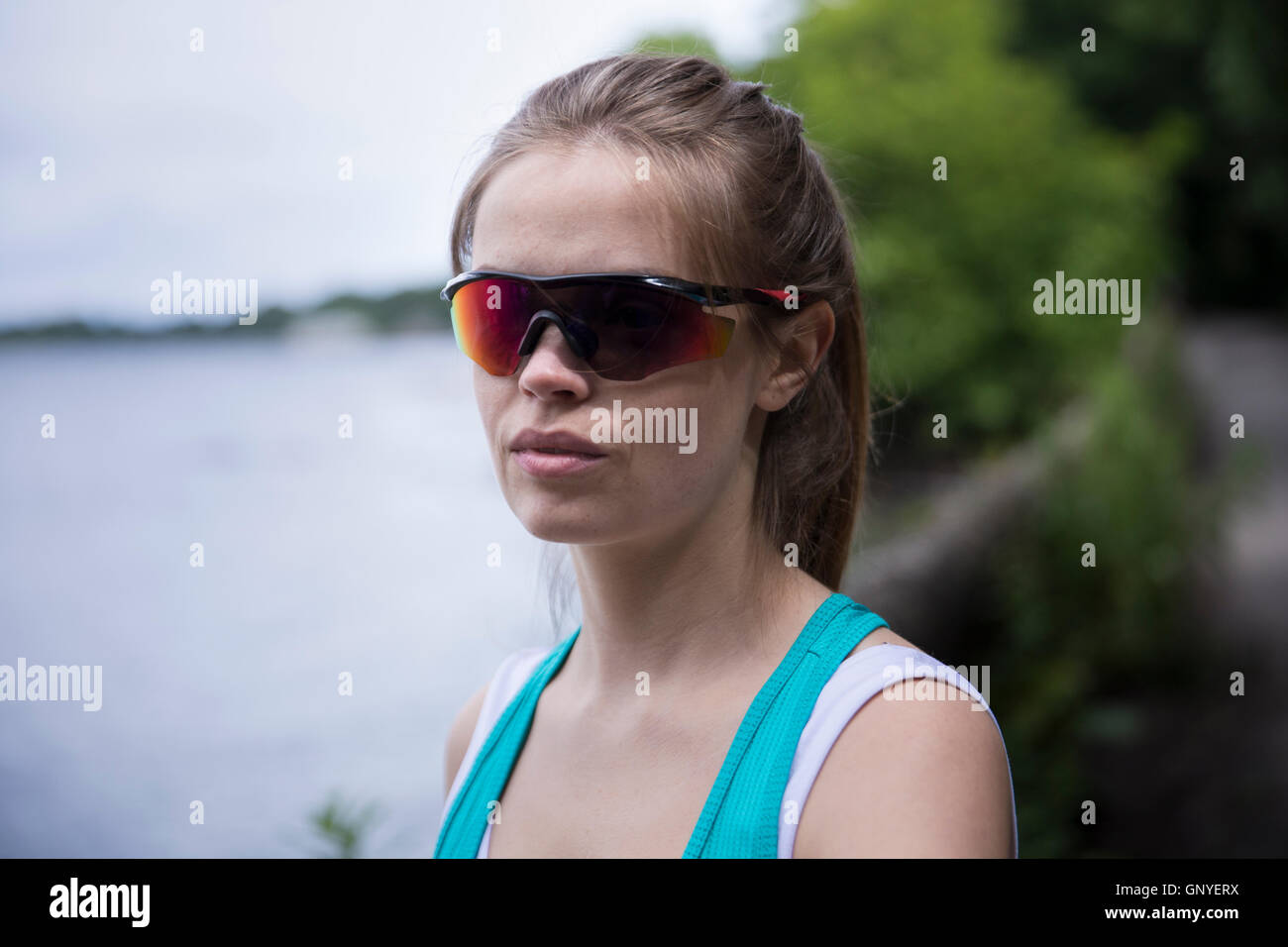 Portrait of a sporty woman outdoors. Action and healthy lifestyle concept. Stock Photo