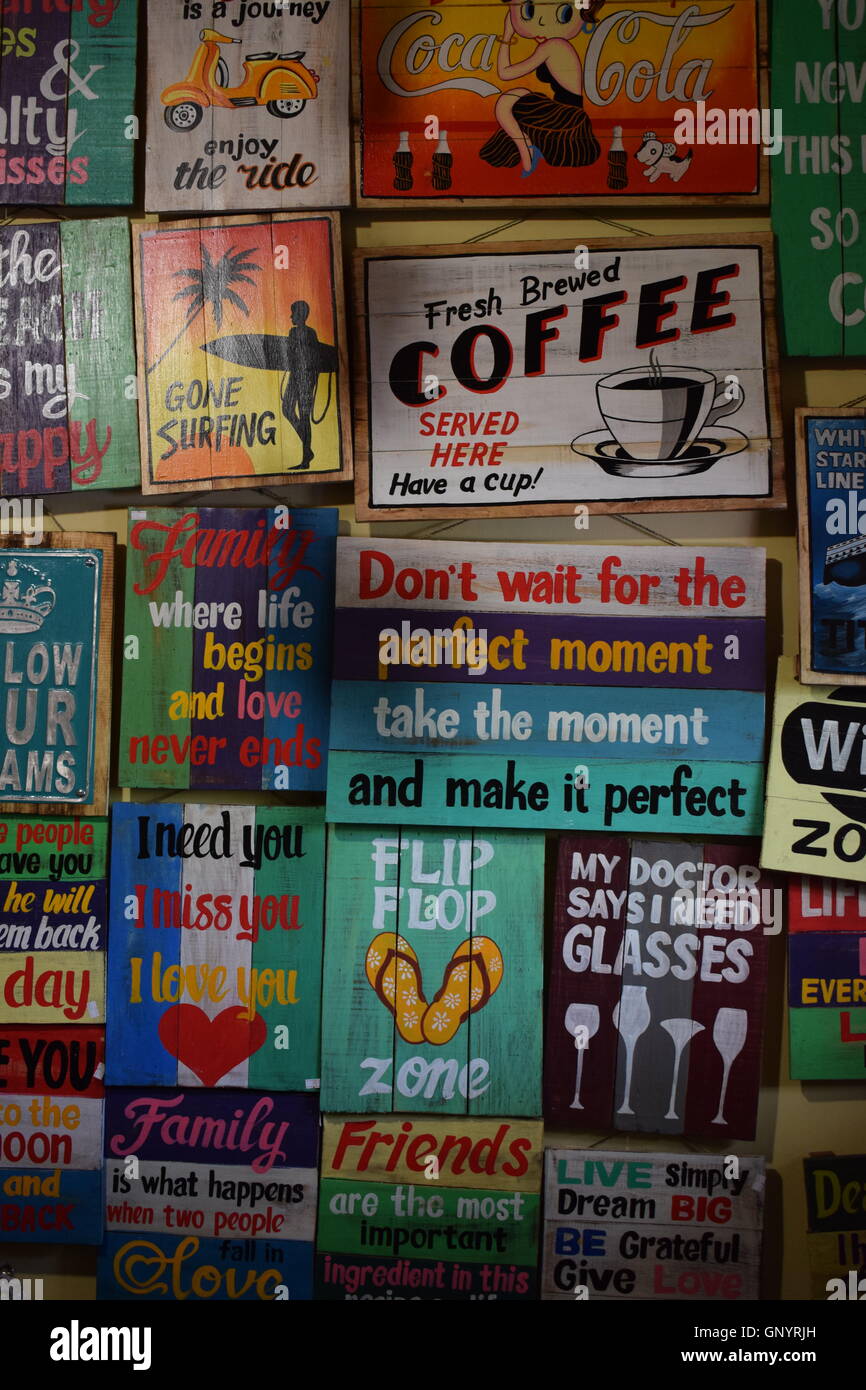 Wall of Wooden Plaques with sayings on them Stock Photo Alamy