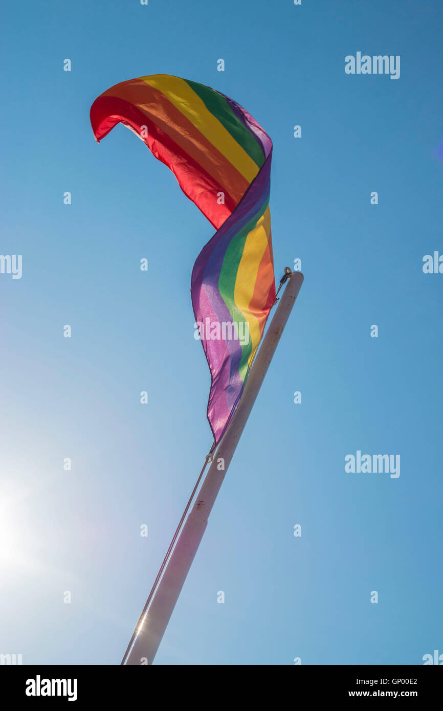 Iconic rainbow Pride flag against blue sky Stock Photo - Alamy