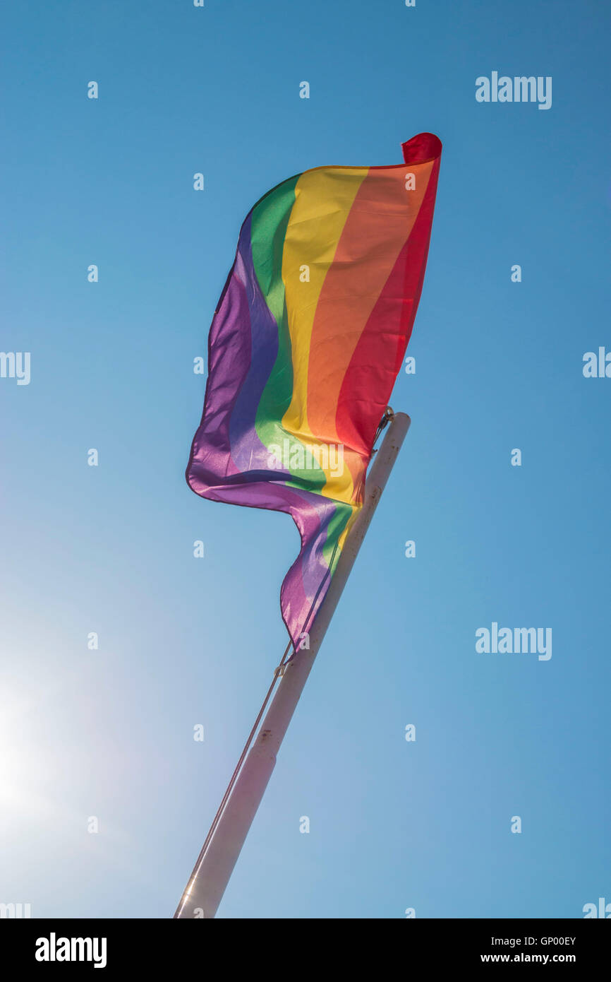 Iconic rainbow Pride flag against blue sky Stock Photo - Alamy