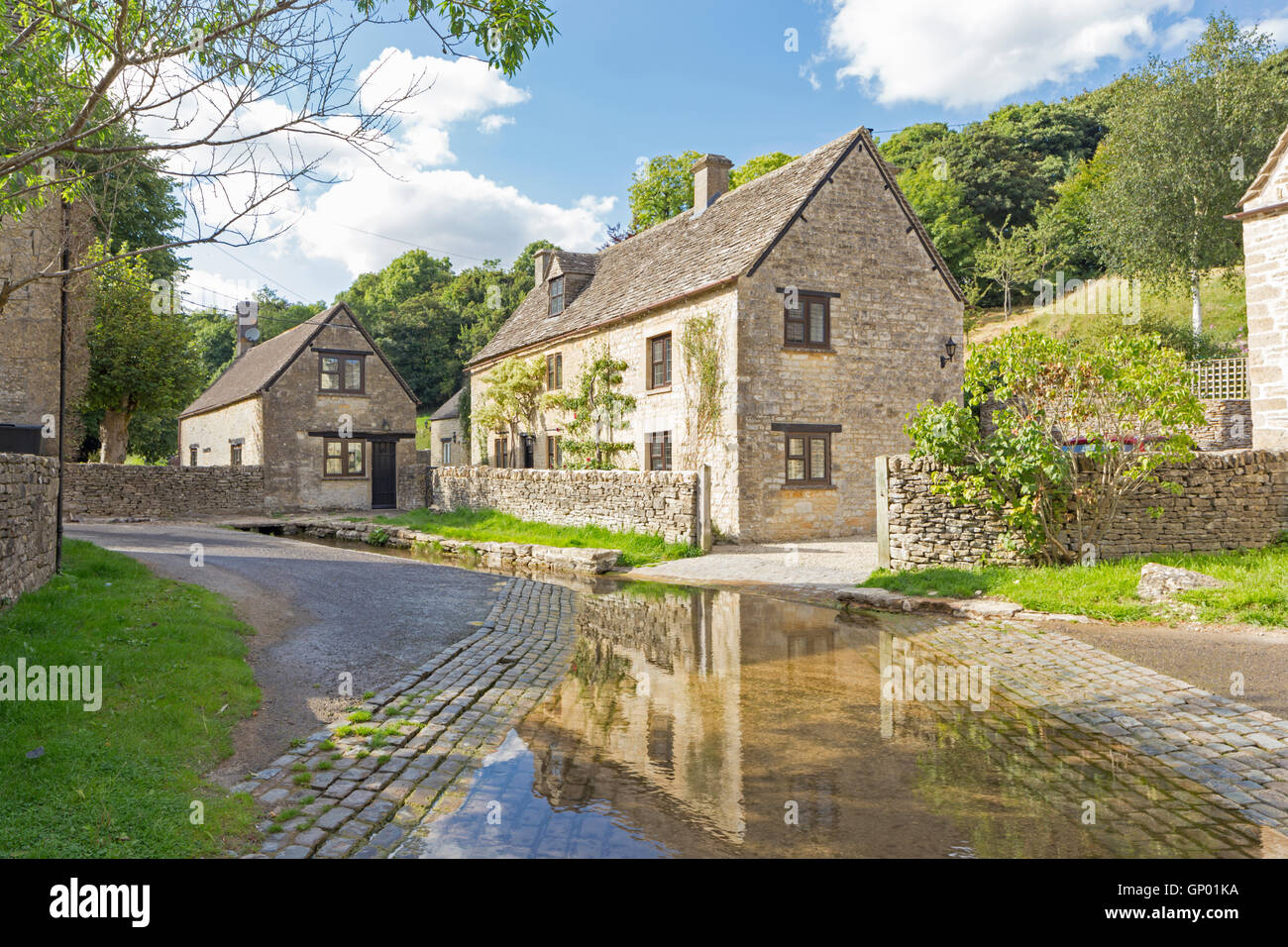 The River Dunt passes through the village of Duntisbourne Leer where this attractive ford can found, Gloucestershire, England. Stock Photo