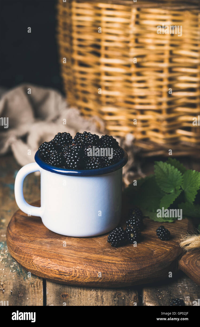 Fresh Blackberries in white cup on round serving wooden Stock Photo Alamy
