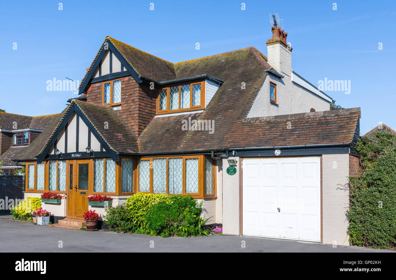 Large 1930s detached house in Mock Tudor style with double glazed windows in West Sussex, England, UK. Stock Photo