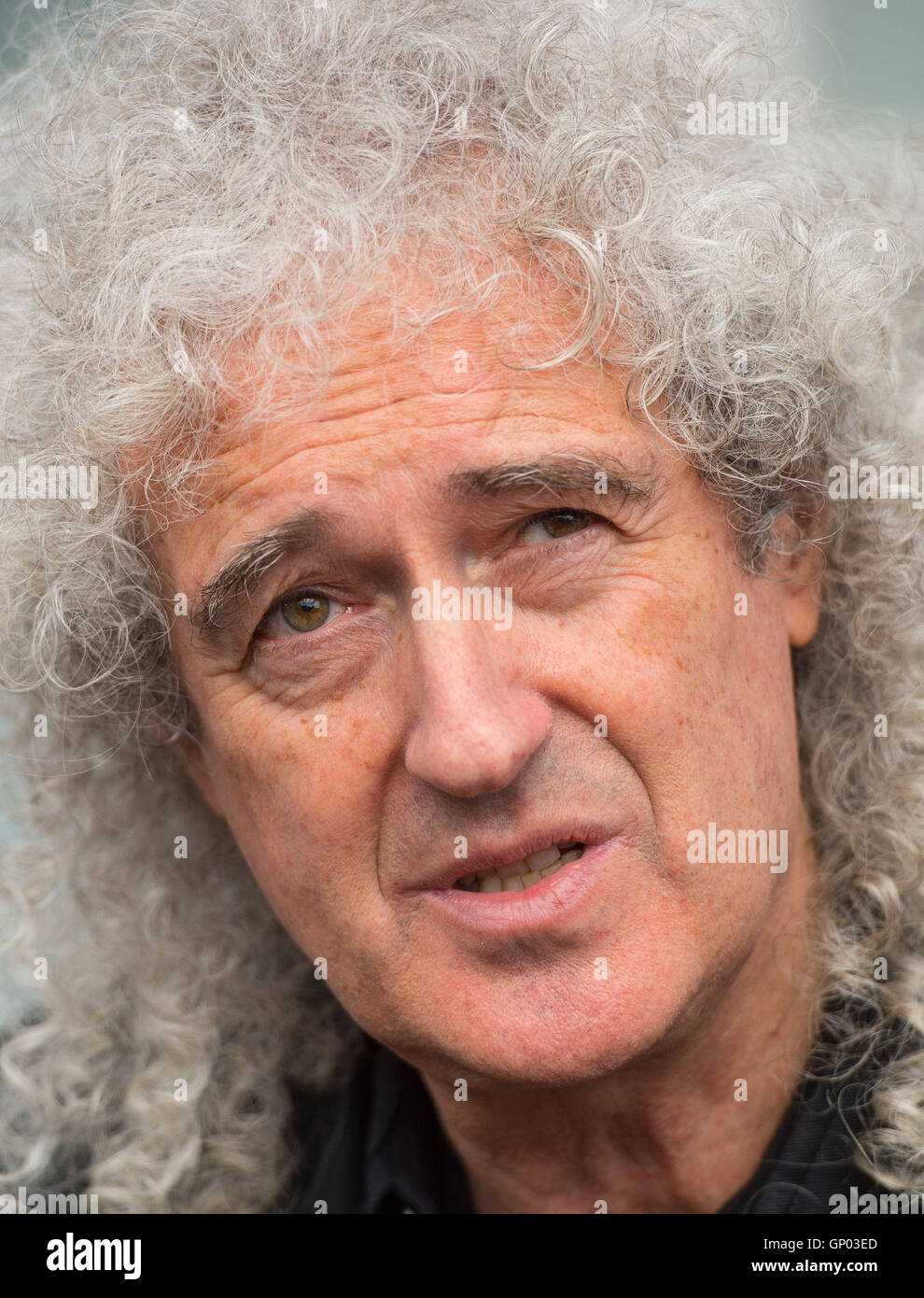 Queen guitarist Brian May at the unveiling of an English Heritage blue plaque to the band's lead singer, Freddie Mercury, at his former home at 22 Gladstone Avenue in Feltham, west London. Stock Photo