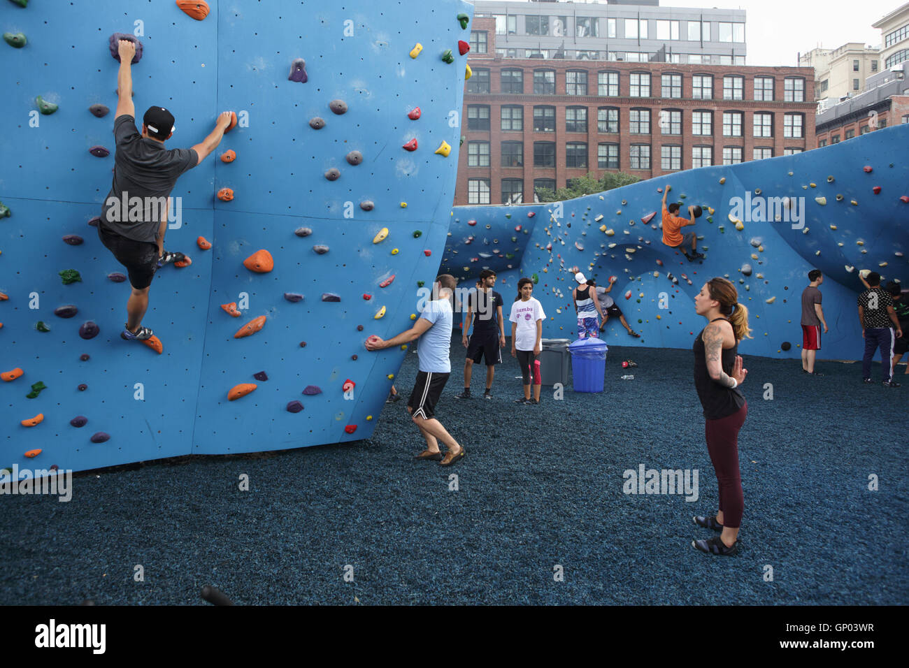 Climbing wall under the Manhattan Bridge in DUMBO, Brooklyn. Climbers