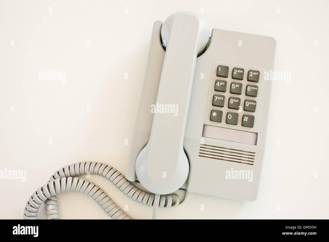Push button telephone on white surface Stock Photo Alamy