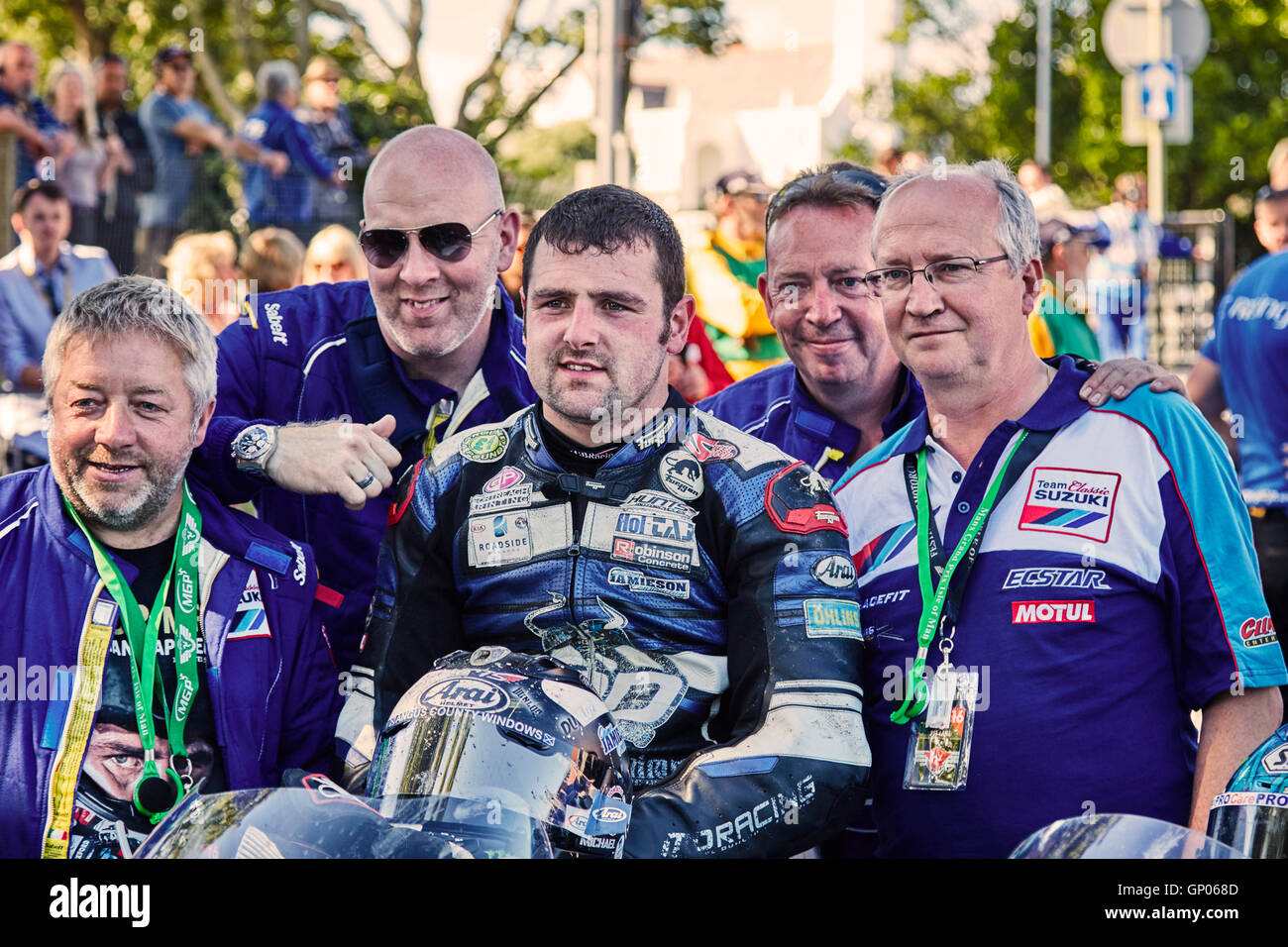 Michael Dunlop winner, in the TT classic superbike race at the Manx Festival of Motorcycling 2016 with team members Stock Photo