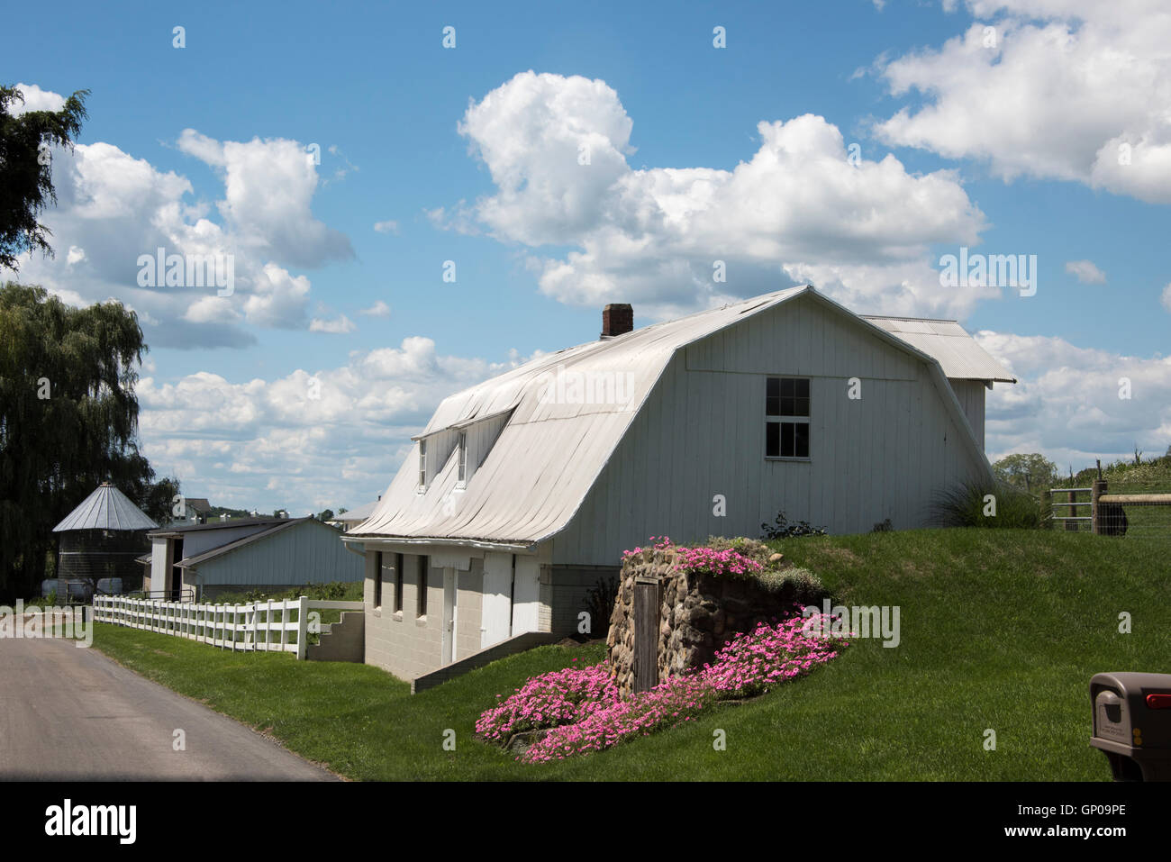 Amish barn well maintained on rural country road Holmes County Ohio USA Stock Photo