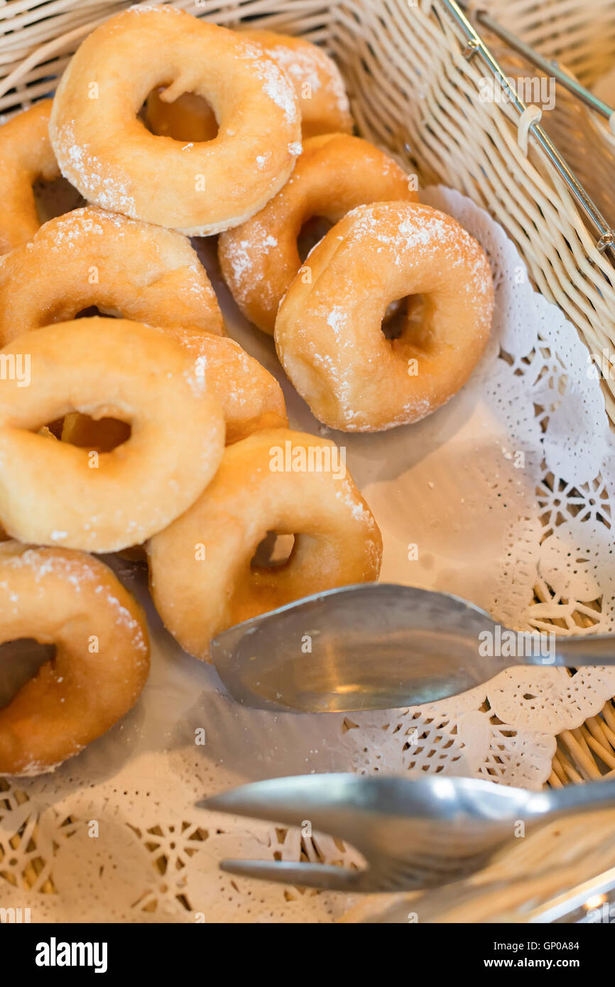 Basket of powdered sugar donuts Stock Photo
