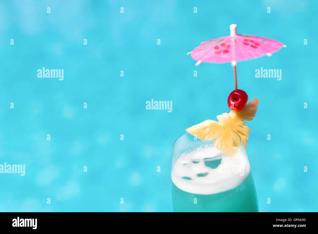 Cocktail glasses at pool, beach side. Stock Photo