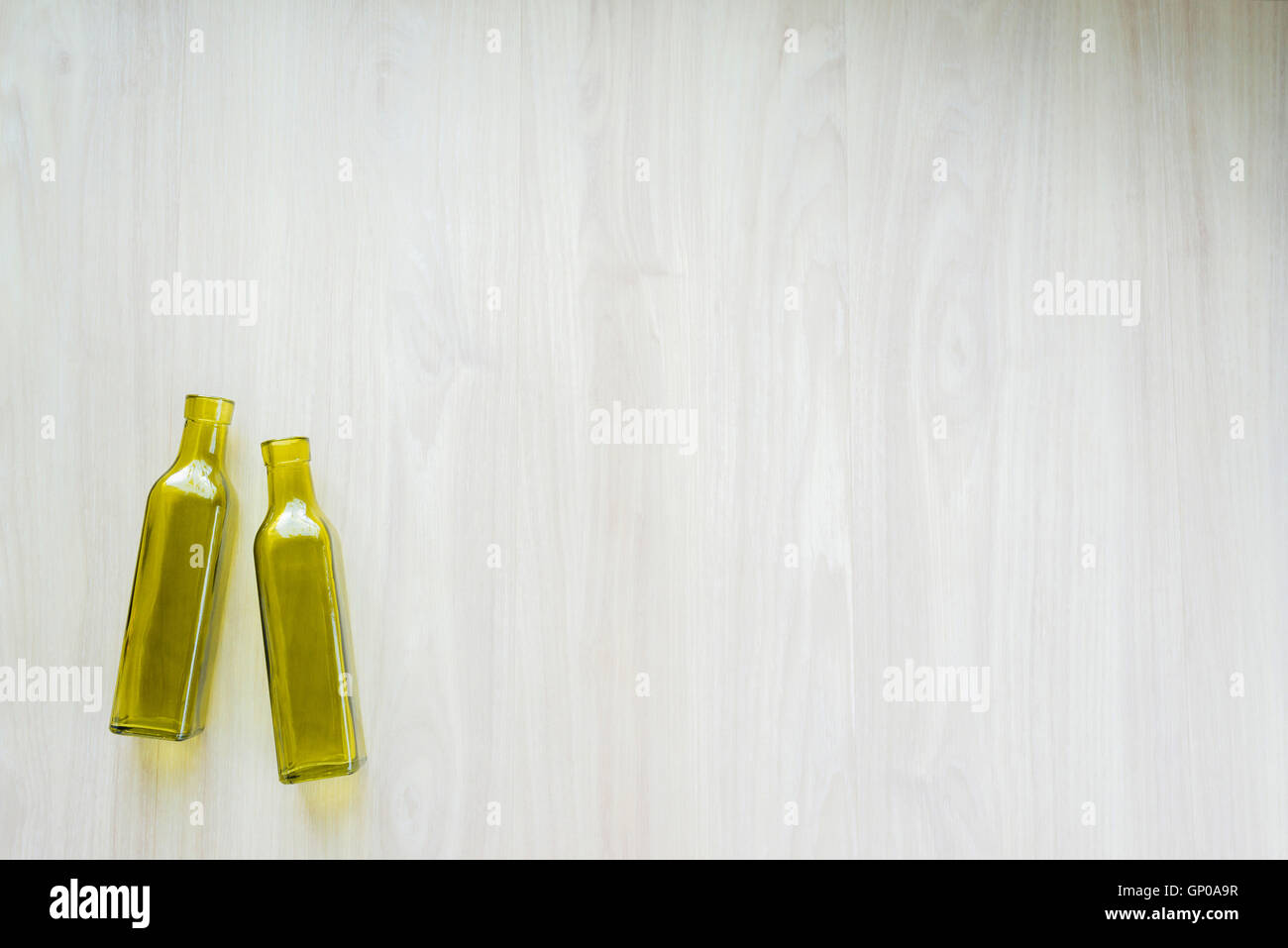two empty bottles on white wooden background Stock Photo