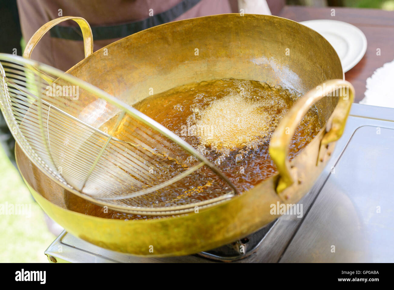 fried shrimp cooking in brass pan, thai cuisine, thai cooking class. Stock Photo