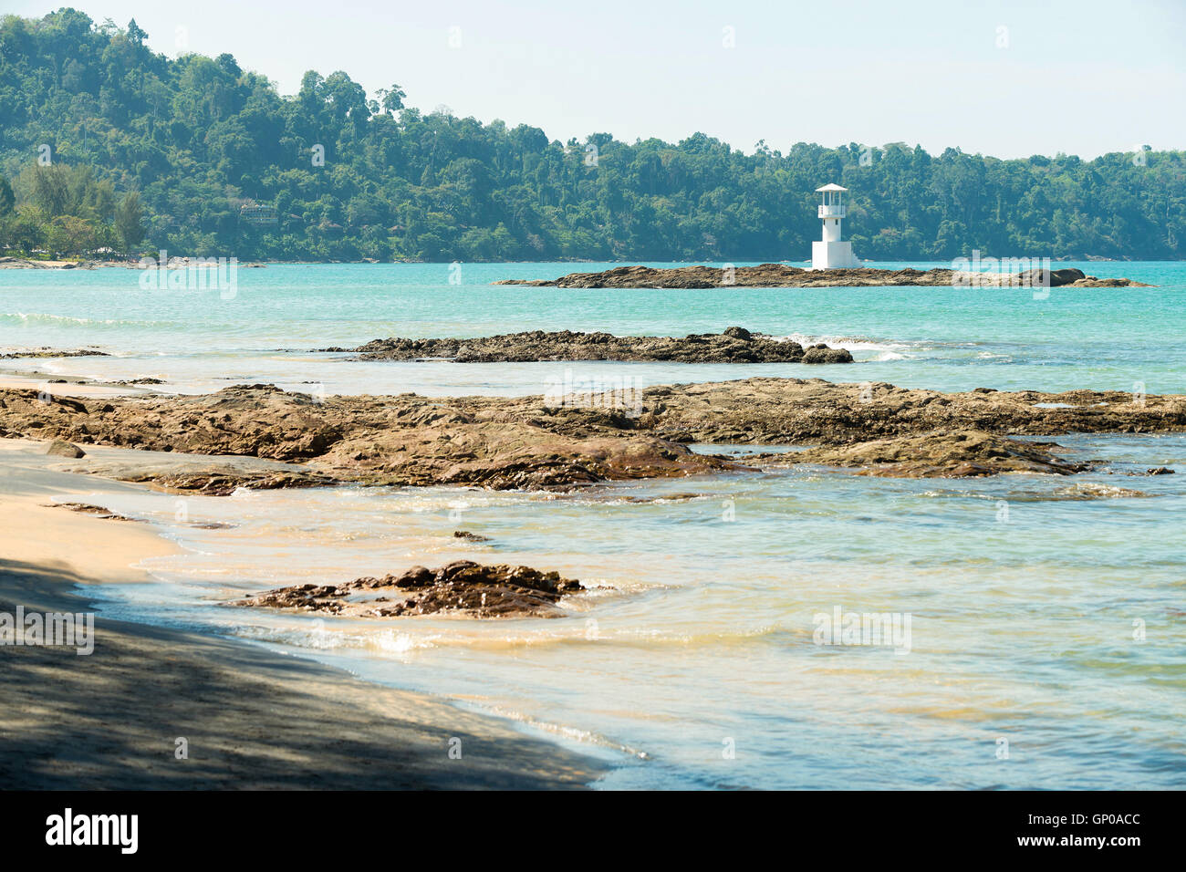 Seascape, beach, sea and lighthouse seeing from beach. Stock Photo