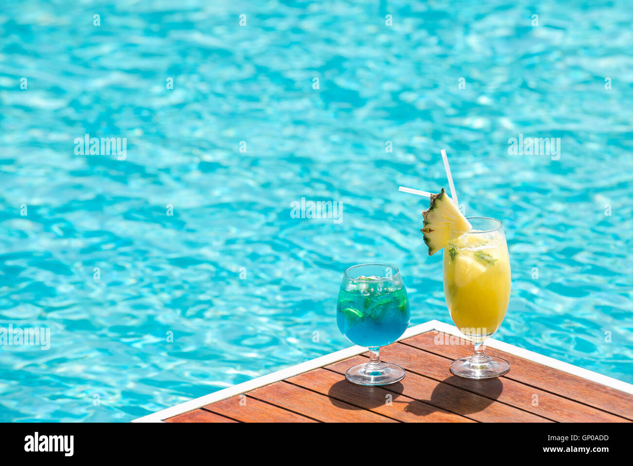 Cocktail glasses at pool, beach side. copy space. Stock Photo