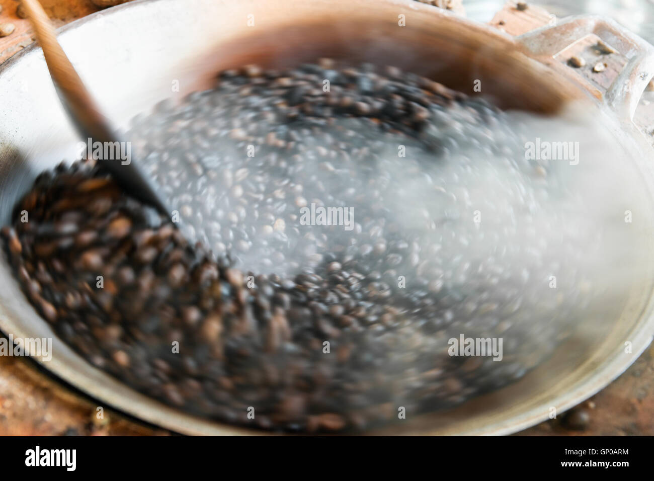 Traditional roasting coffee beans in pan, motion blur Stock Photo Alamy