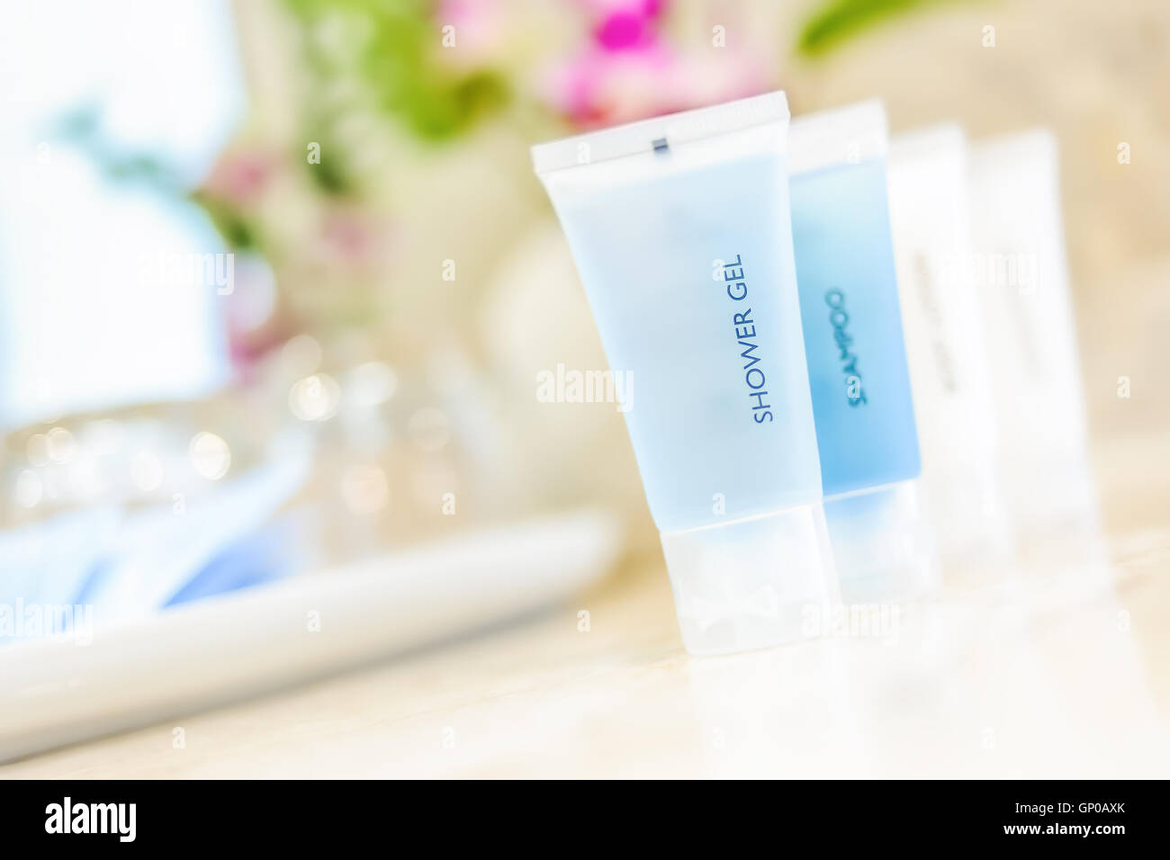 Toiletries tube in a luxury hotel, shower gel, shampoo, hair conditioner, body lotion. Stock Photo