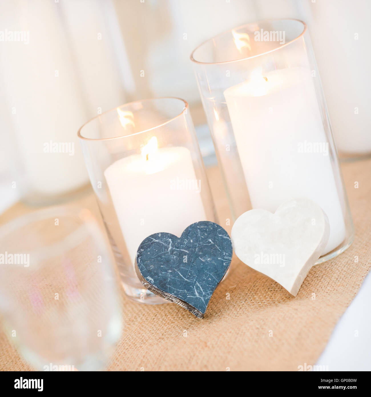 candles, marble hearth shape, setting for celebration on dinner table