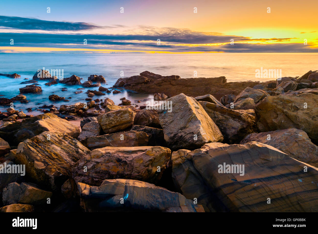Dramatic sunset with clouds above the sea, South Australian shore. Long