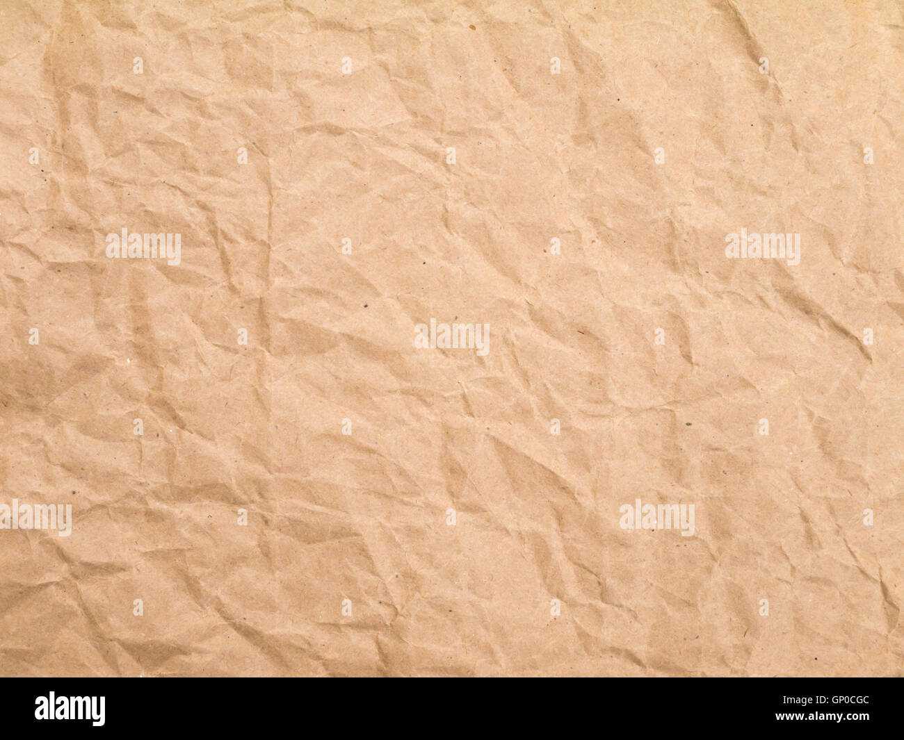 Brown crumpled wrapping paper sheet background Stock Photo