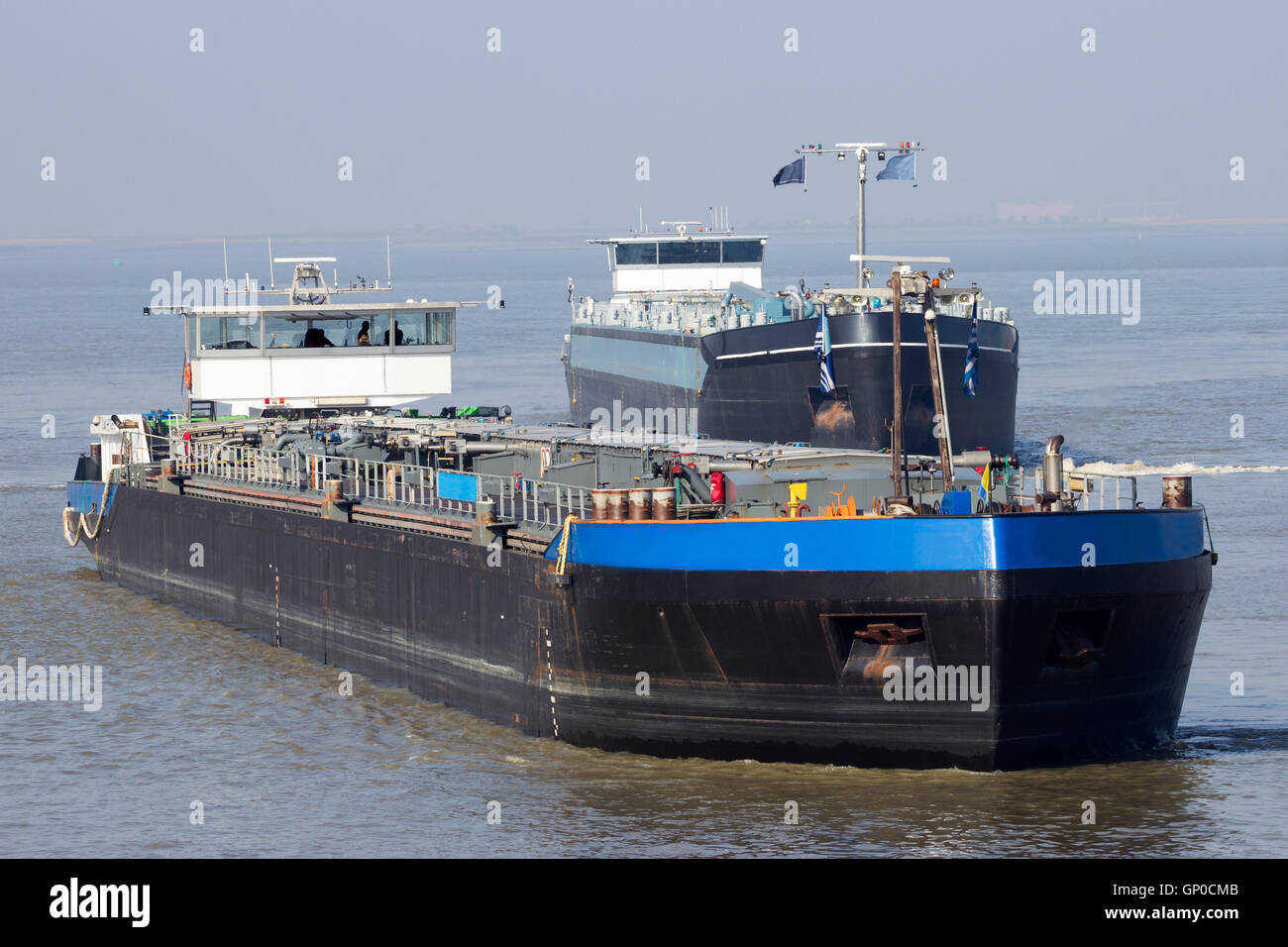 Tanker barges on the Scheldt river near Antwerp. Stock Photo