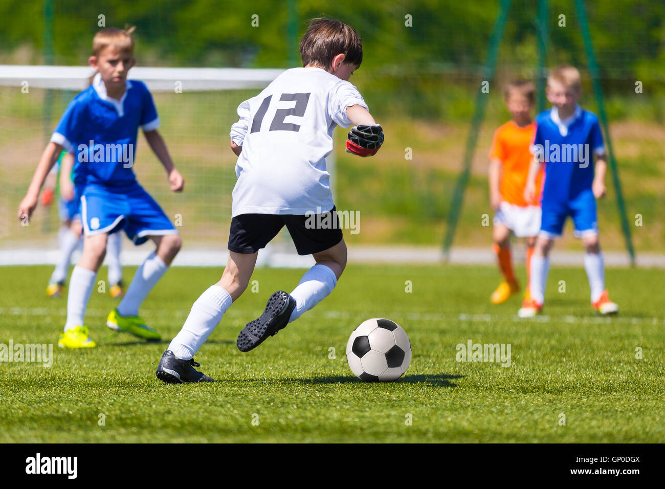 Young Boys Playing Soccer Football Match Children Kicking Soccer