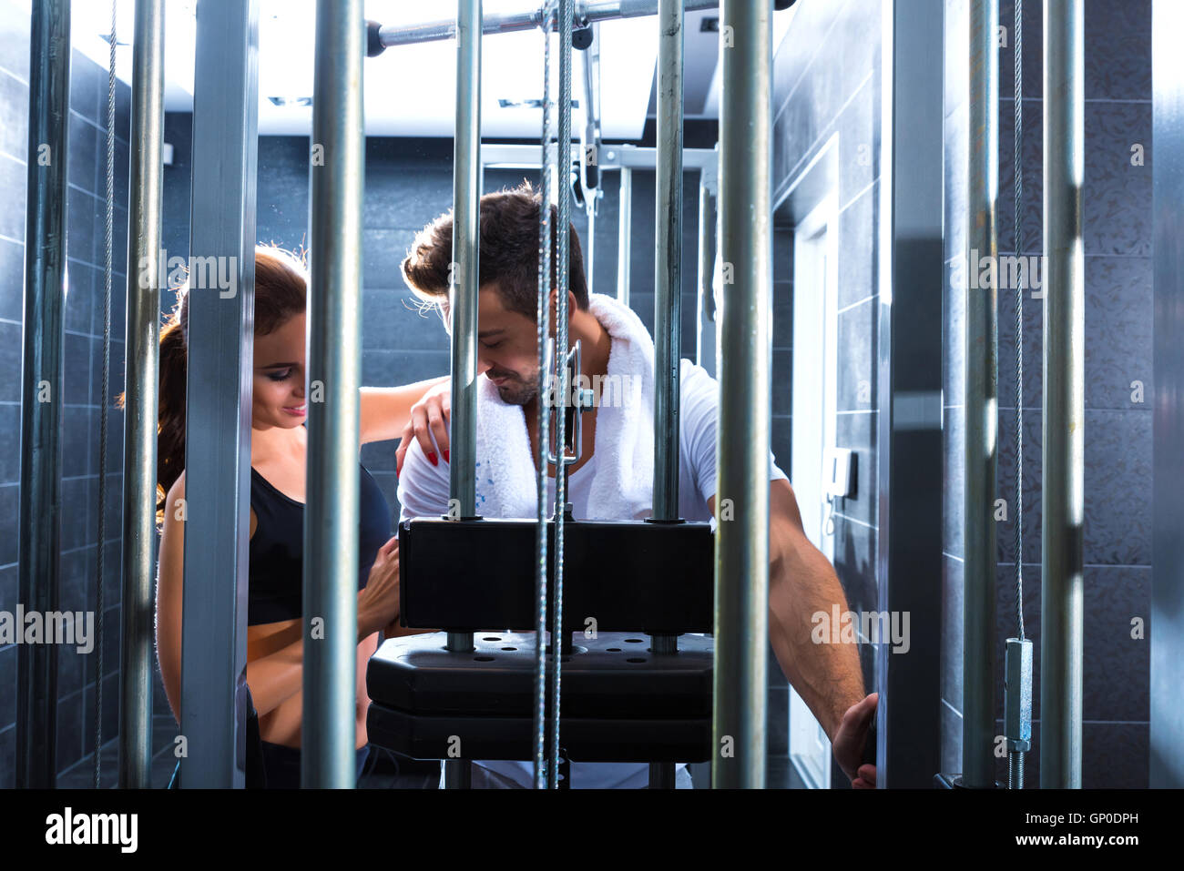 A young couple training together in the Gym Stock Photo - Alamy